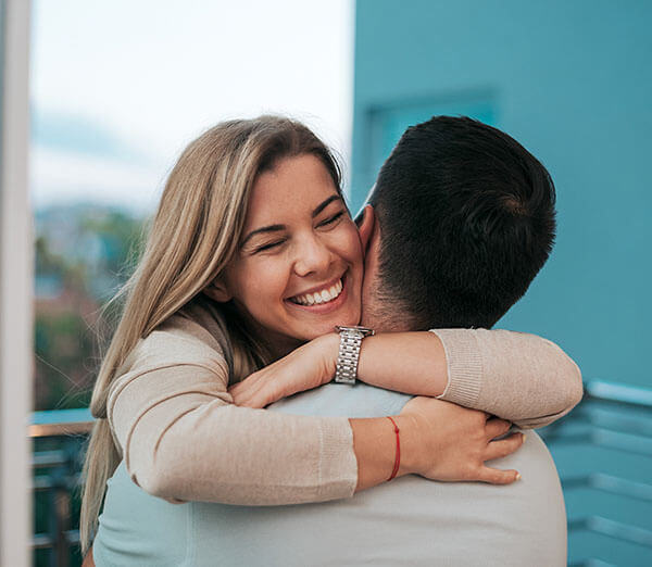 Adoptive parents embracing